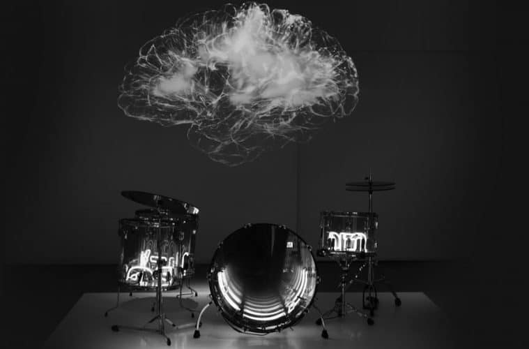 Image of stylised brain hovering like a cloud over a drum kit